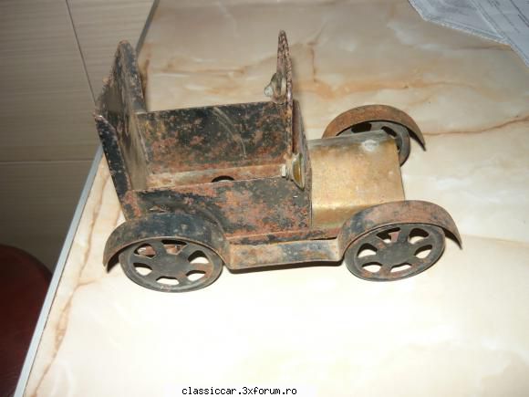 maasinuta din tabla 
50 lei jucarii vechi din tabla romanesti