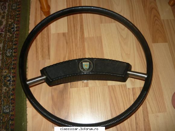 este in stare foarte buna 
pret 150 lei volan dacia 1300 cu banutul colorat si scris dacia  1300