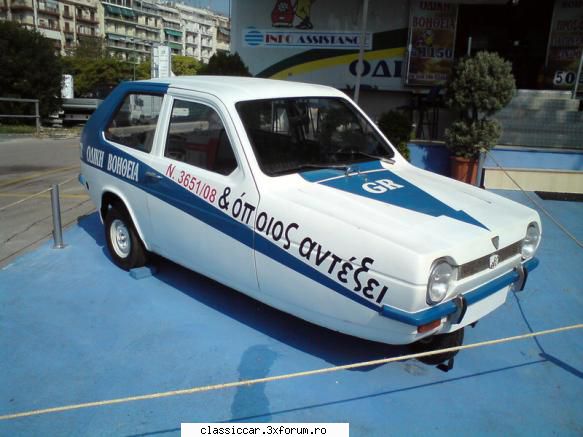 din grecia - Este reklama in fata unei firme de tractari - Din lumea larga